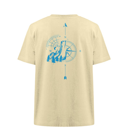 Visualmotviation - Unisex Freestyler Heavy Oversized T-Shirt aus 100% Bio-Baumwolle mit Rückseiten Druck, Motiv: Kompass und Berge in Cyan. Shirtfarbe: Natural Raw-7052